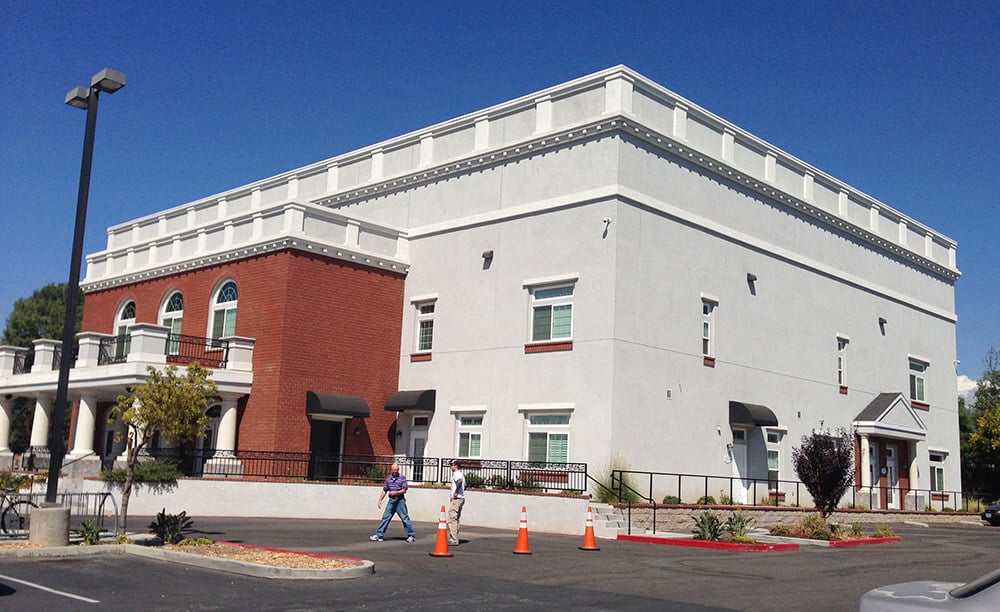The lighthouse baptist church stands against deep blue skies
