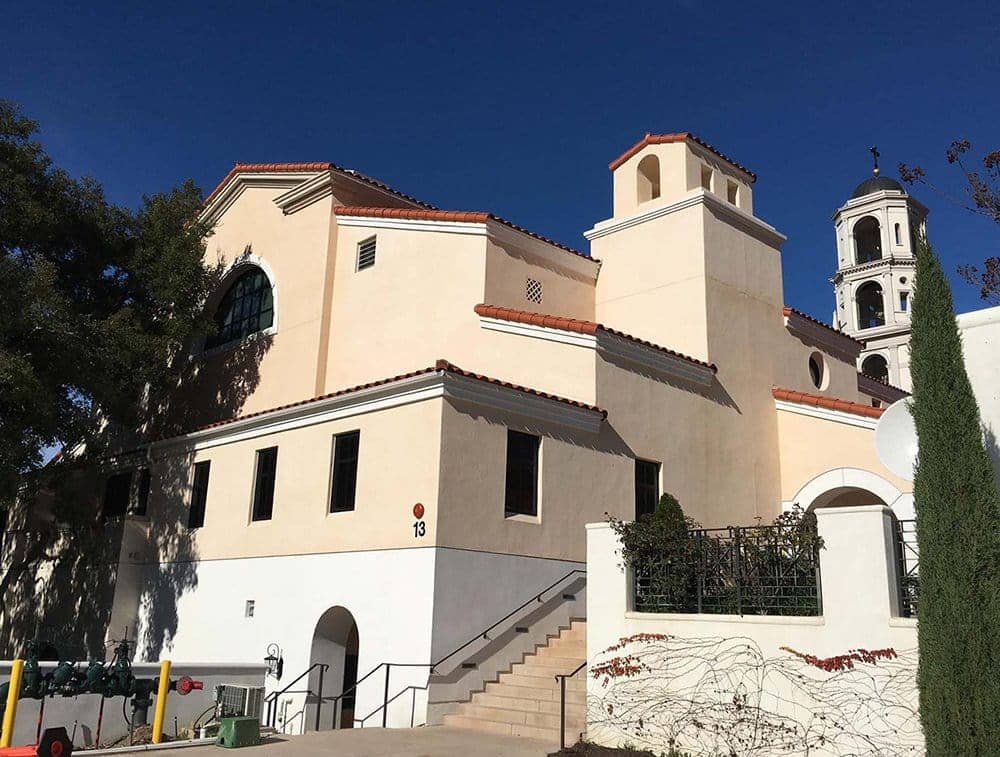 The exterior of a church is shown, inside are i-joists