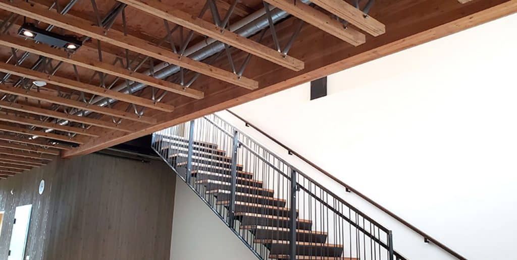 Open web trusses are shown next to a staircase