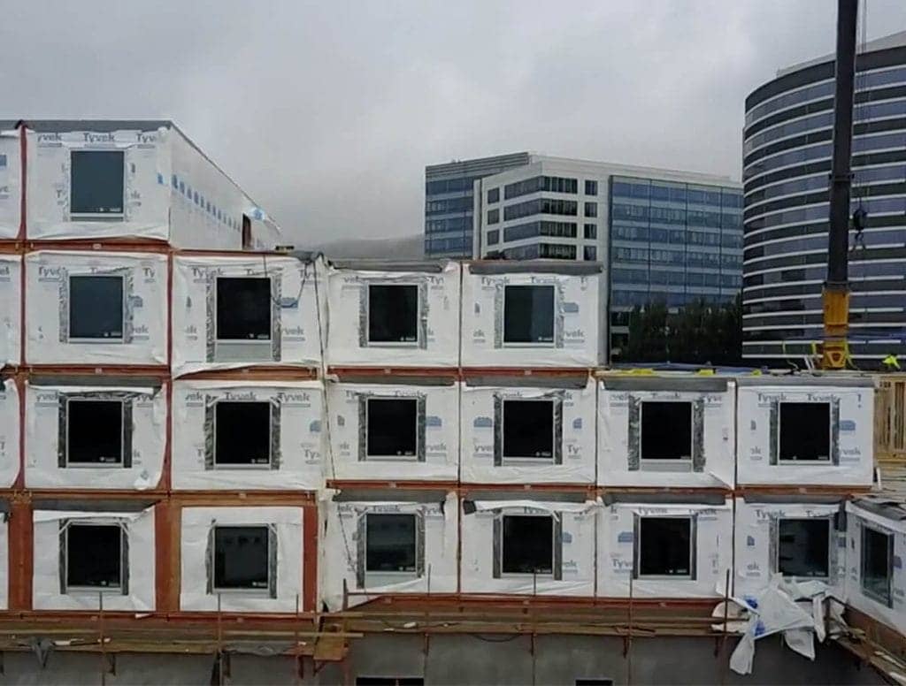 A stack of components in a job site that were made with offsite construction