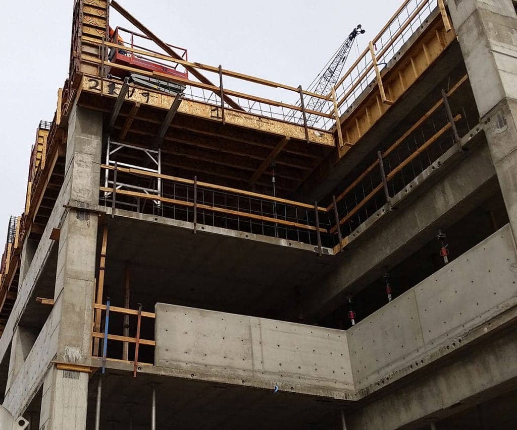 The corner of a parking garage as it's in a forming and shoring phase