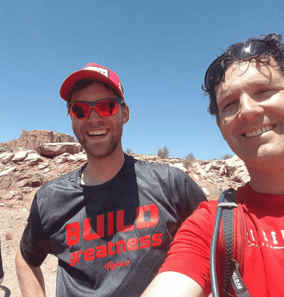 A RedBuilt staffer poses with a buddy while hiking
