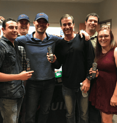 RedBuilt team members pose for the camera at an office event