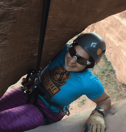 A woman is rock climbing