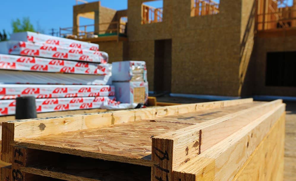 RedBuilt I-joists sit in the sunlight at a jobsite