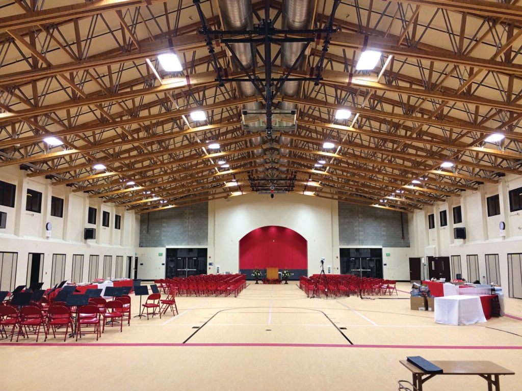 interior of taylor middle school with exposed open web scissor trusses