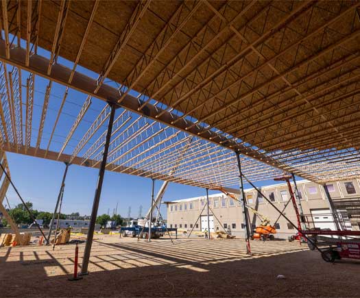 Image of open web trusses being installed